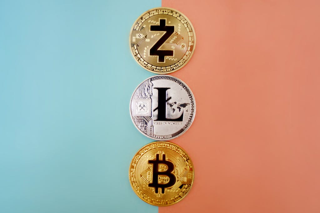 Colorful display of Zcash, Litecoin, and Bitcoin coins on gradient background.